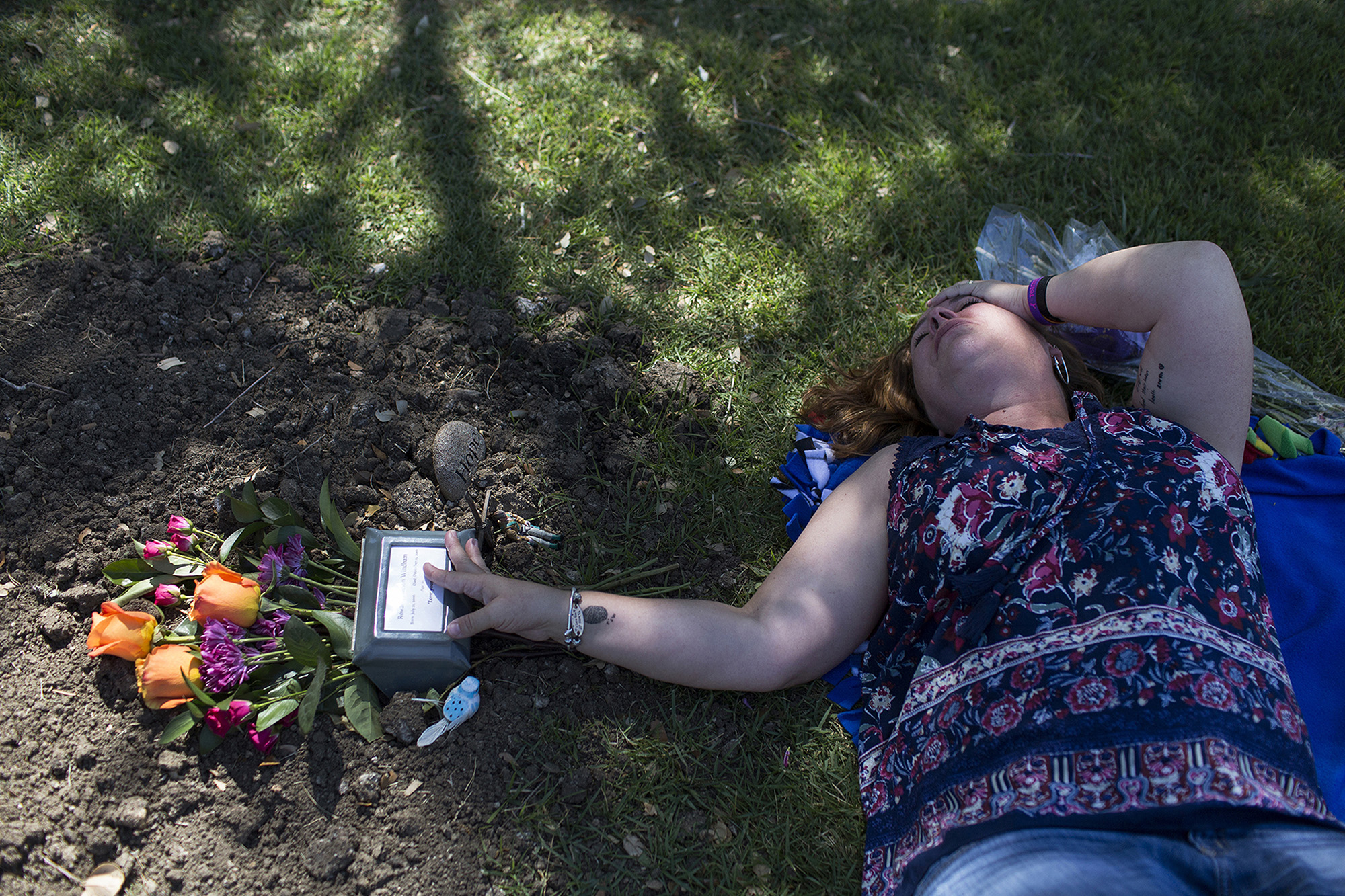Carrie visits Rowan's grave near New Braunfels on Mother's Day, May 14, 2017. Carrie had not only lost her son a few months earlier, but her mother also died unexpectedly three weeks before Rowan's death. The night before Mother's Day, Carrie wrote on her blog: "Rowan, I vividly remember you entering this world ... too early, small, weak, blue. But you were such a fighter, such a shining light in this often dark world. In ten years, you taught me a lifetime of lessons. Then, during the biggest battle of your life ... which you still loved, as much as ever ... you were gone in what felt like an instant. 151 days ago, my world turned upside down. I watched you take your last unassisted breaths, and then you left this world, just like you entered it ... too early, small, weak, blue."