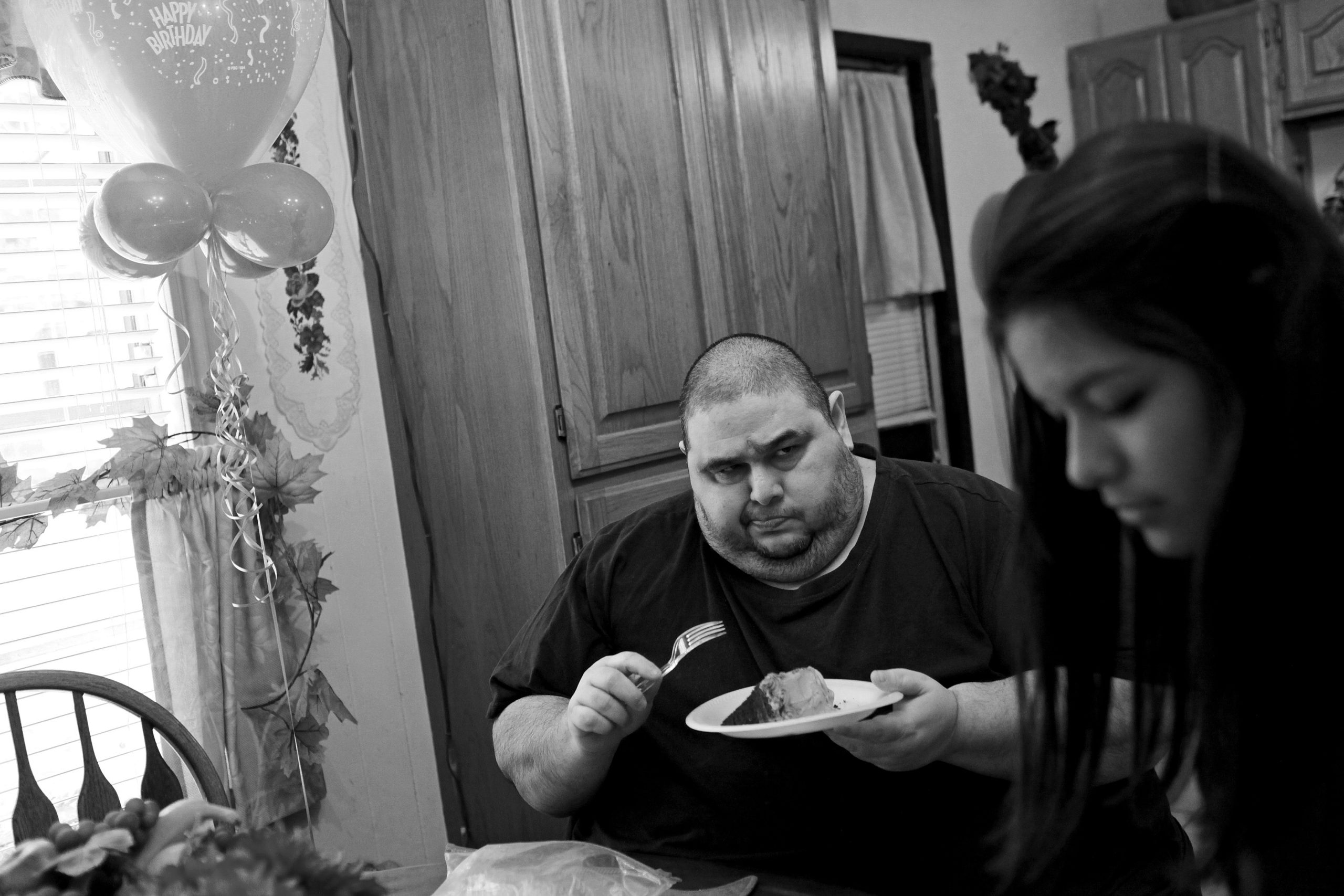 Hector Garcia Jr. is skeptical of the sugar-free cake his mother bought for him as he celebrates his 45th birthday with his niece, Lauren Ibarra, in November 2010. "Food didn't mistreat me. Food never said anything bad to me, so I took comfort in eating. And I was making the problem worse," Hector now realizes.