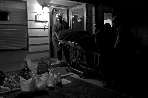 Hector Garcia Jr.'s body is removed from his home Dec. 8, 2014, by contractors with the Bexar County Medical Examiner's Office. Hector had walked 40 feet from his room to answer the front door when his mother arrived home without her key. "Mom, I can't breathe, Mom, I can't breathe," Hector's mother, Elena, described him saying before he collapsed in her recliner. "Just that walk from the bedroom door, that's all it took," she said.